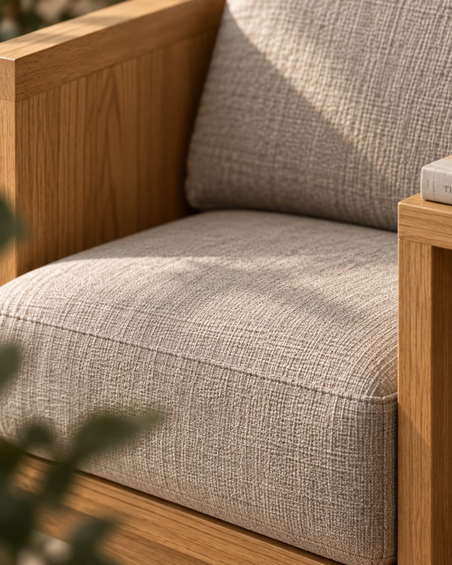 Close detail of the reading chair upholstery and wooden frame