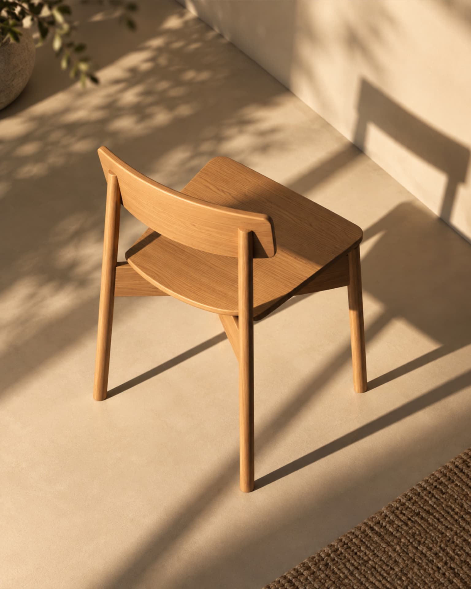 Oak dining chair photographed from above in afternoon light